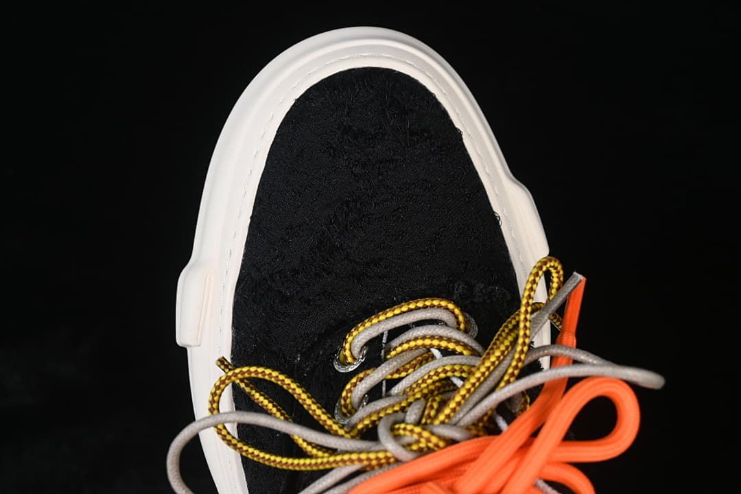 Top view of black toe and multicolor laces