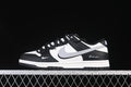 Side view of a black-and-white Nike SB Dunk Low sneaker with a light gray Swoosh.