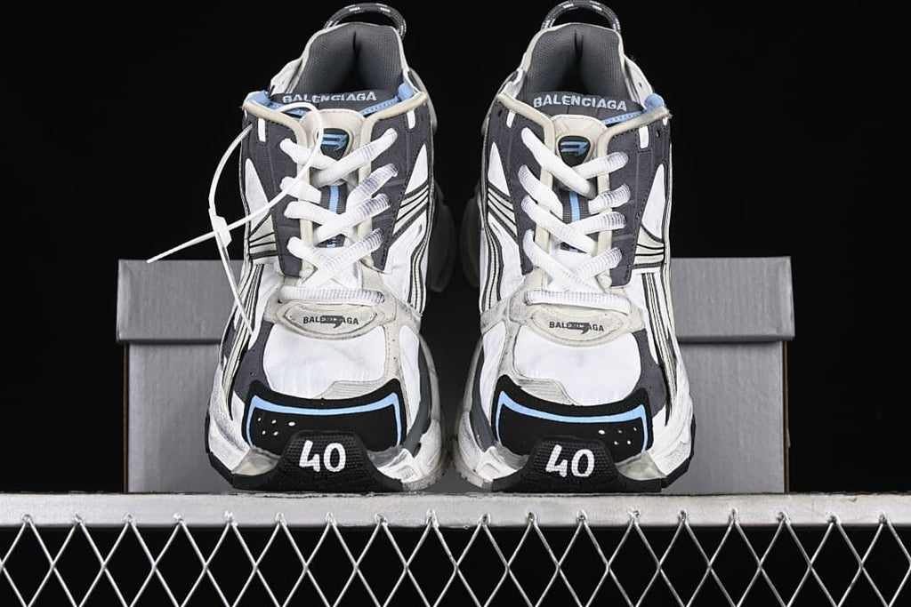 Front view of the pair showing the laces, layered uppers and toe details.