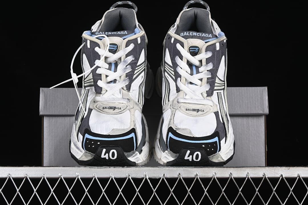 Front view of the pair showing the laces, layered uppers and toe details.