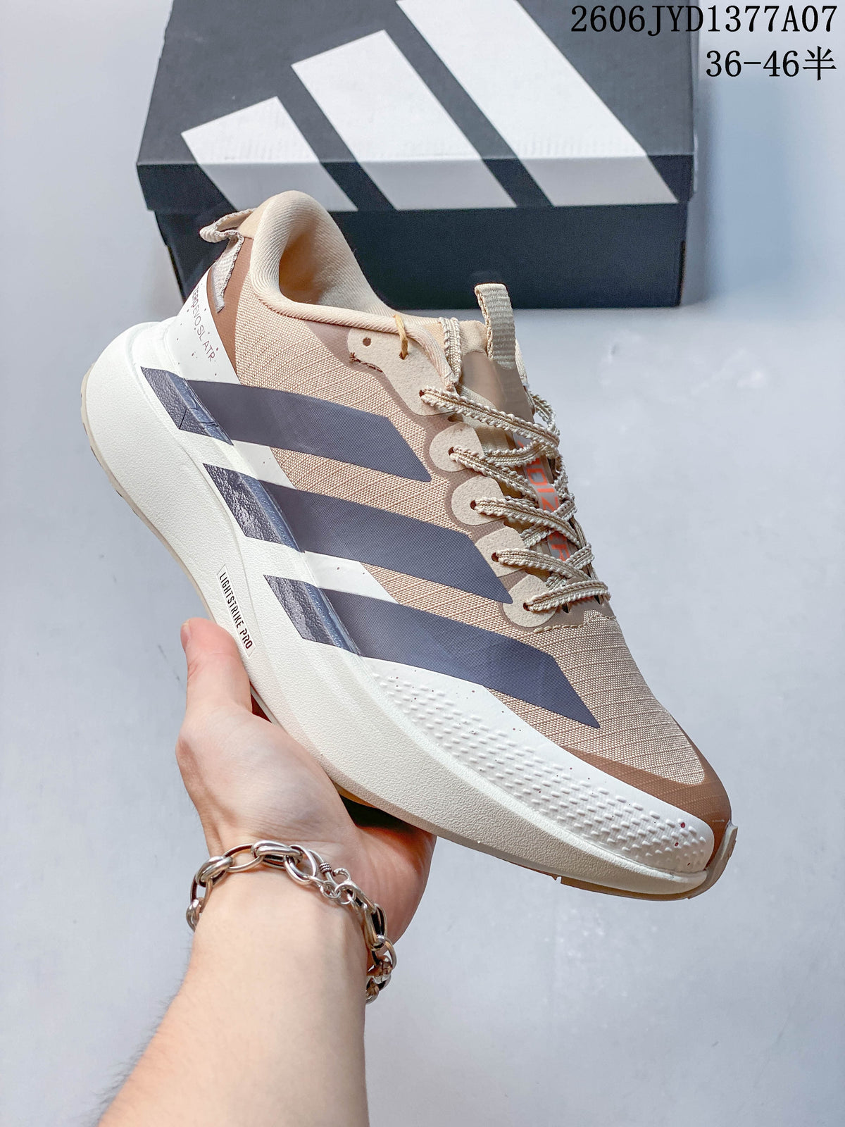 Side profile of a beige and navy Adidas Adizero Evo SL running shoe.