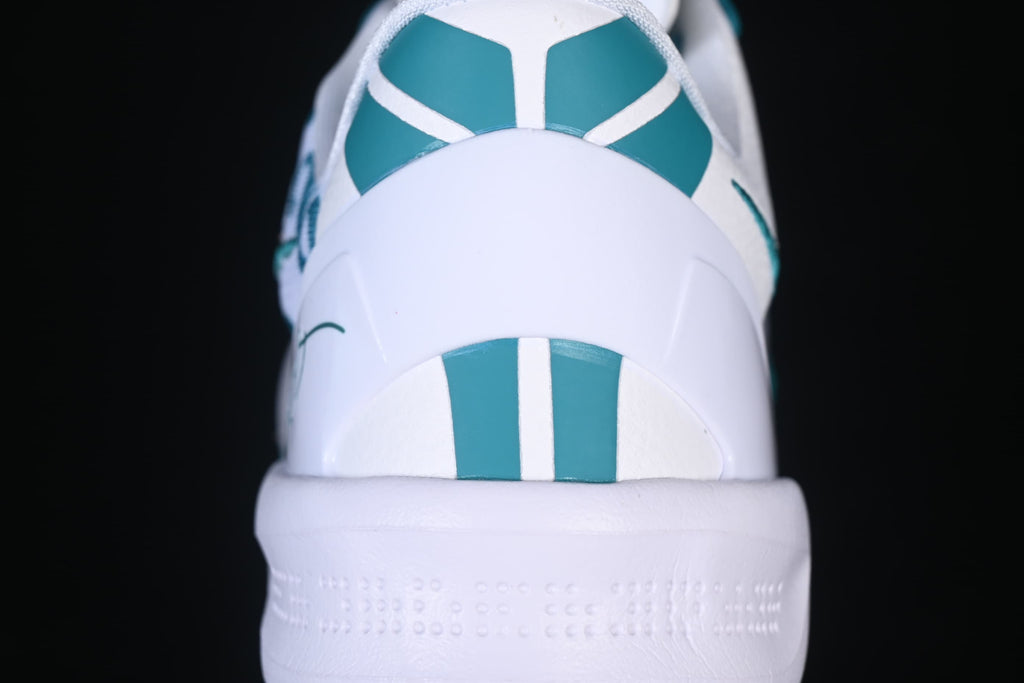 Rear view showing teal and white details on the heel
