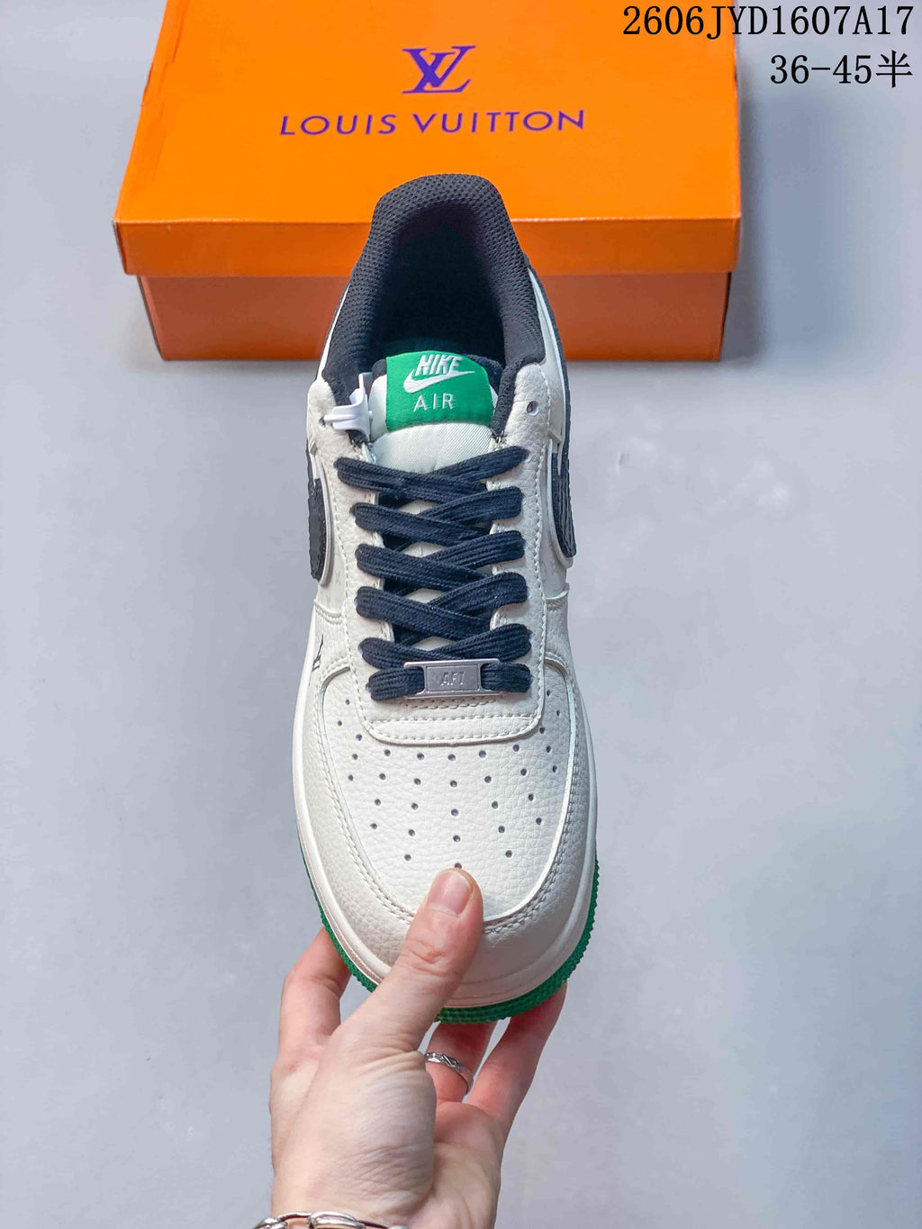 Top view showing perforated toe, dark laces and green tongue label