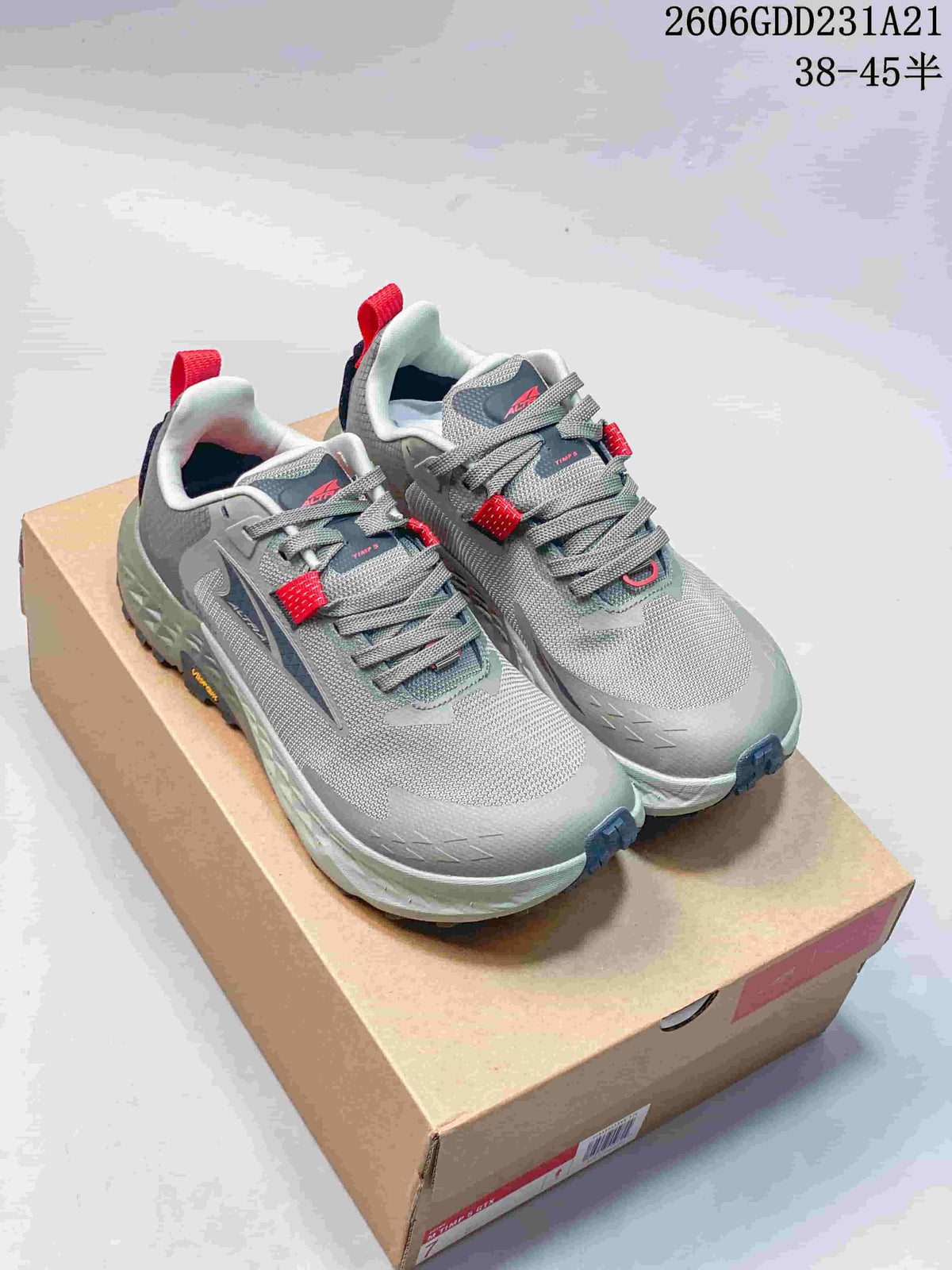 Pair of gray Altra Timp 5 GTX trail running shoes with navy and red accents
