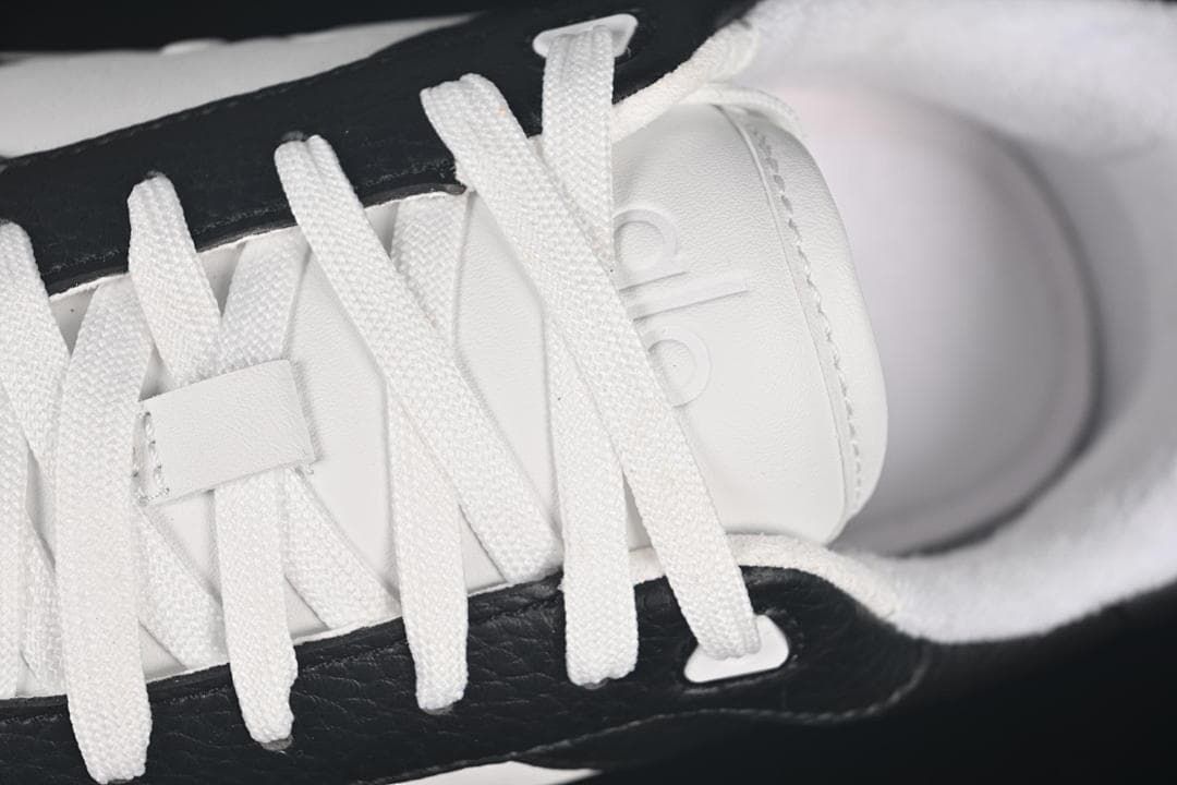 Close-up of white laces and tongue branding