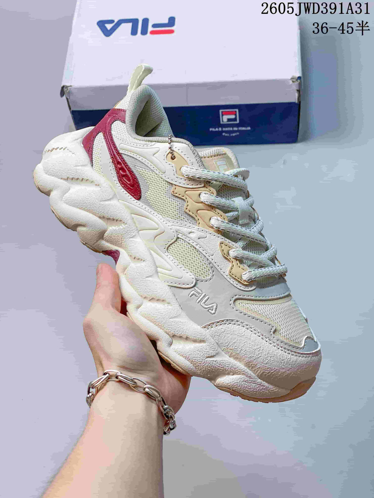 Angled view of the ivory FILA Croissant 1S sneaker with a chunky sculpted sole