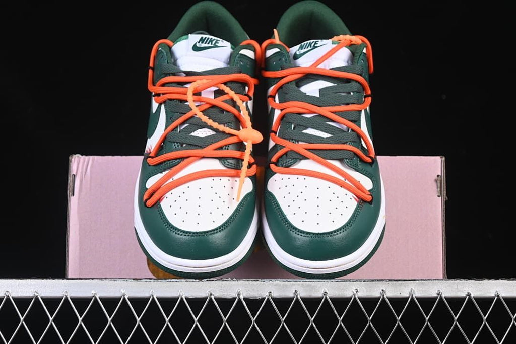 Front view of the pair showing perforated toes and orange laces