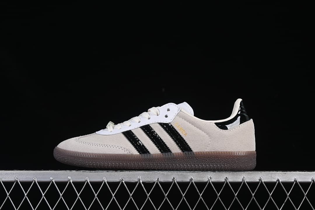 Side profile of the beige and black Samba OG sneaker
