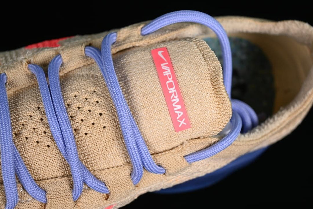 Close-up of the VaporMax tongue label and lavender laces.