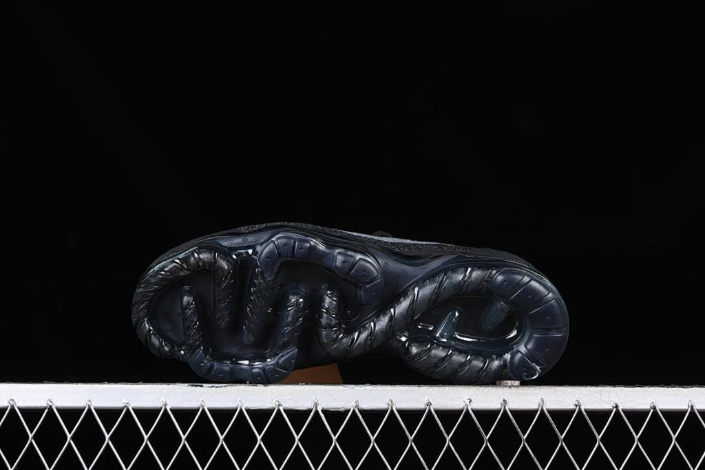 Underside view of the dark contoured sole