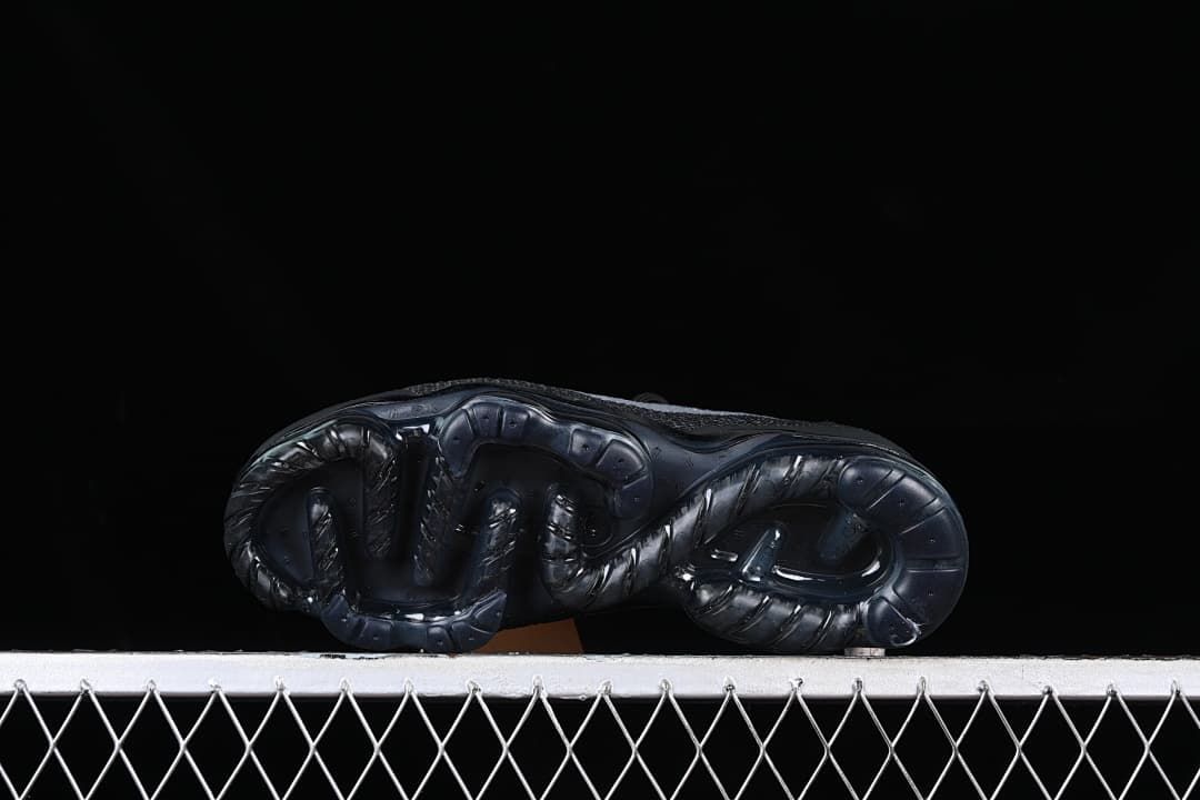 Underside view of the dark contoured sole