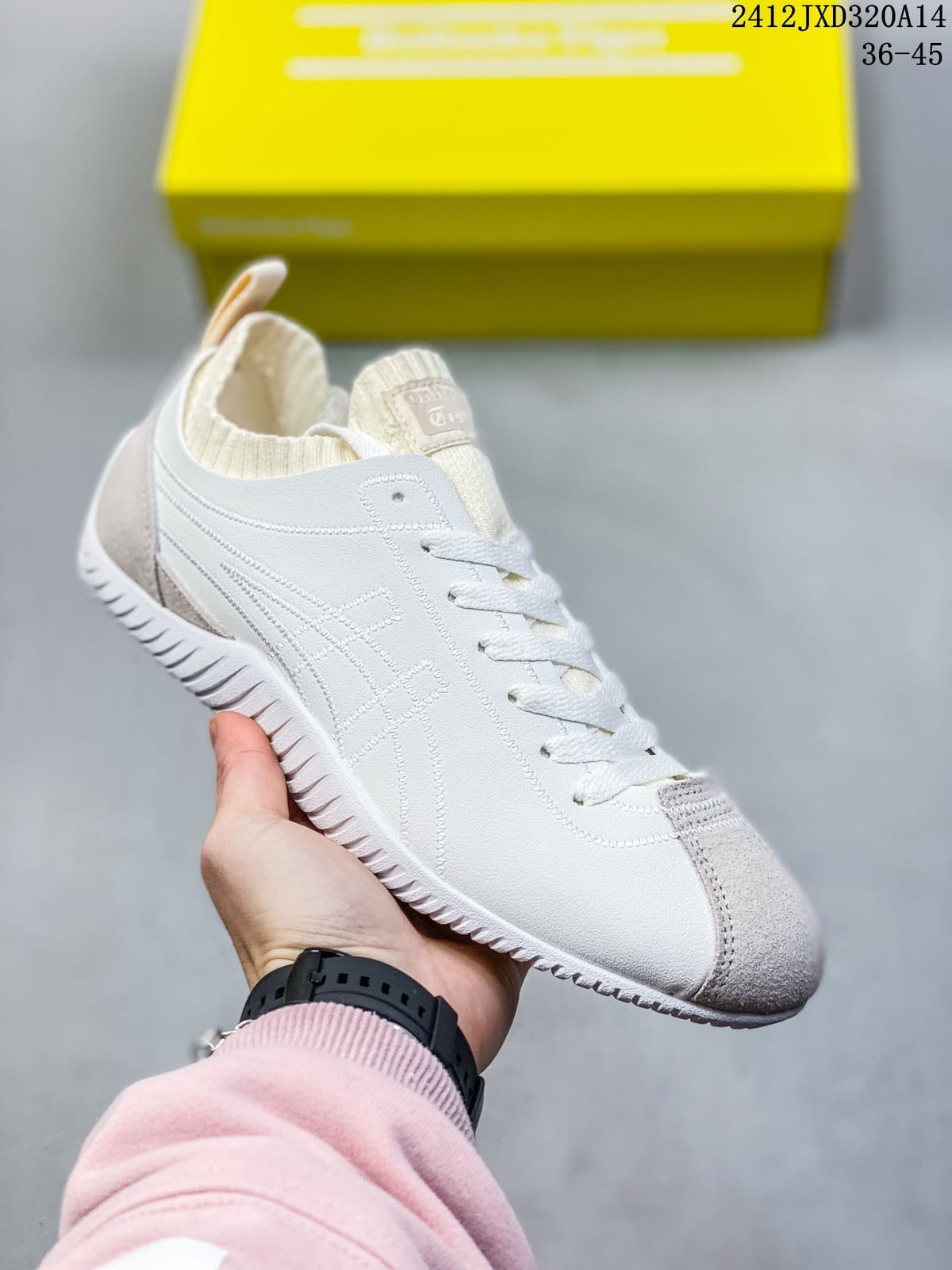 Angled side view of the white and gray low-top sneaker
