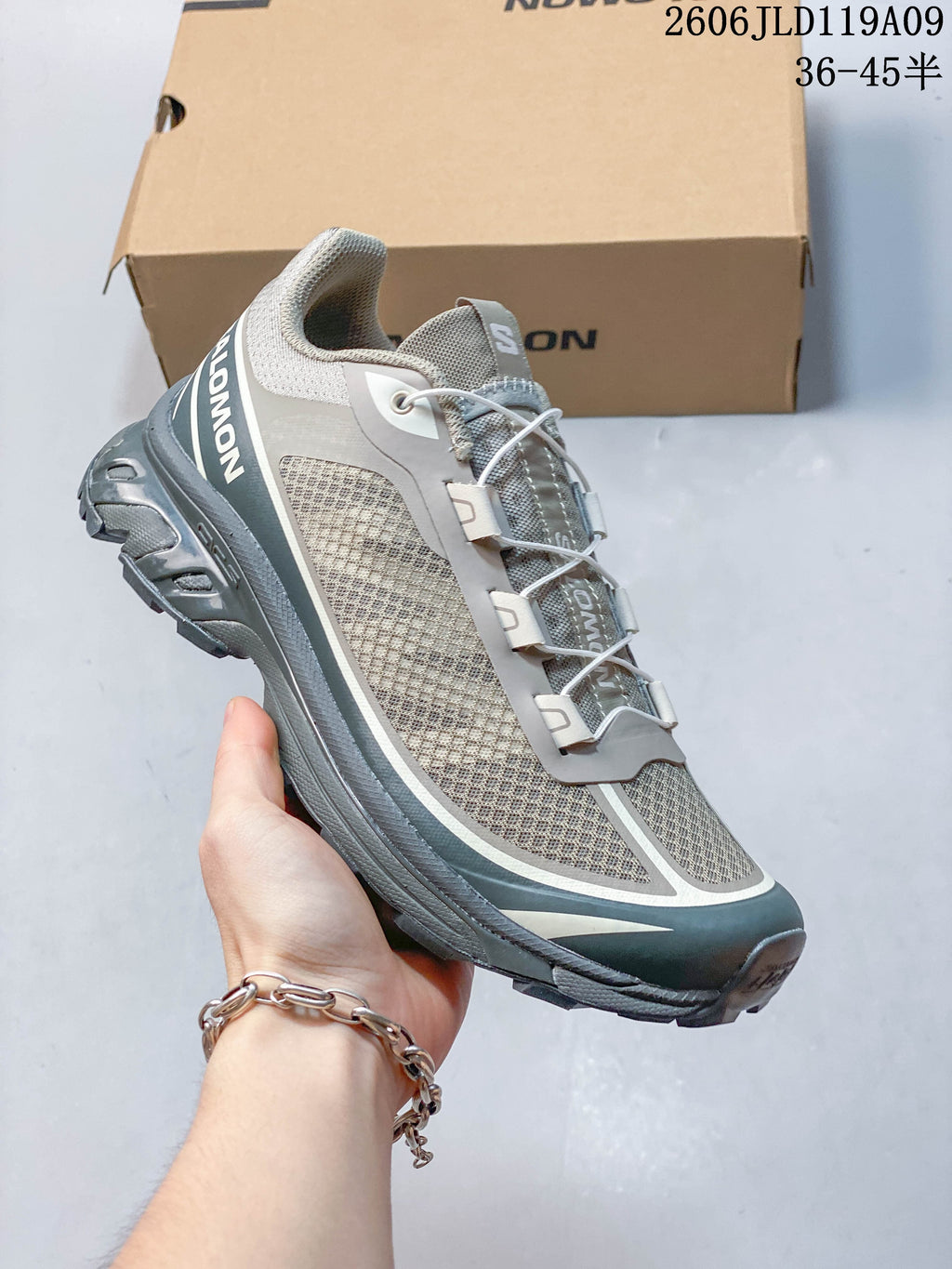 Angled side view of the Salomon XT-6 FT shoe with quick laces and a rugged outsole.