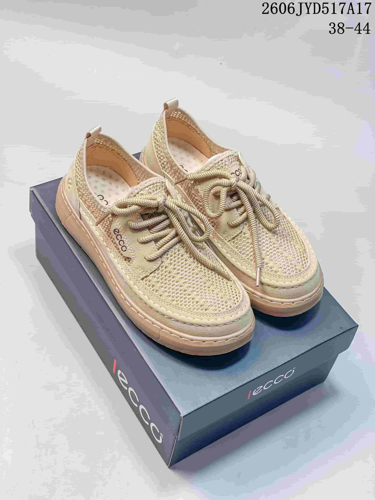 Pair of light beige ECCO-branded lace-up shoes with mesh-like uppers.