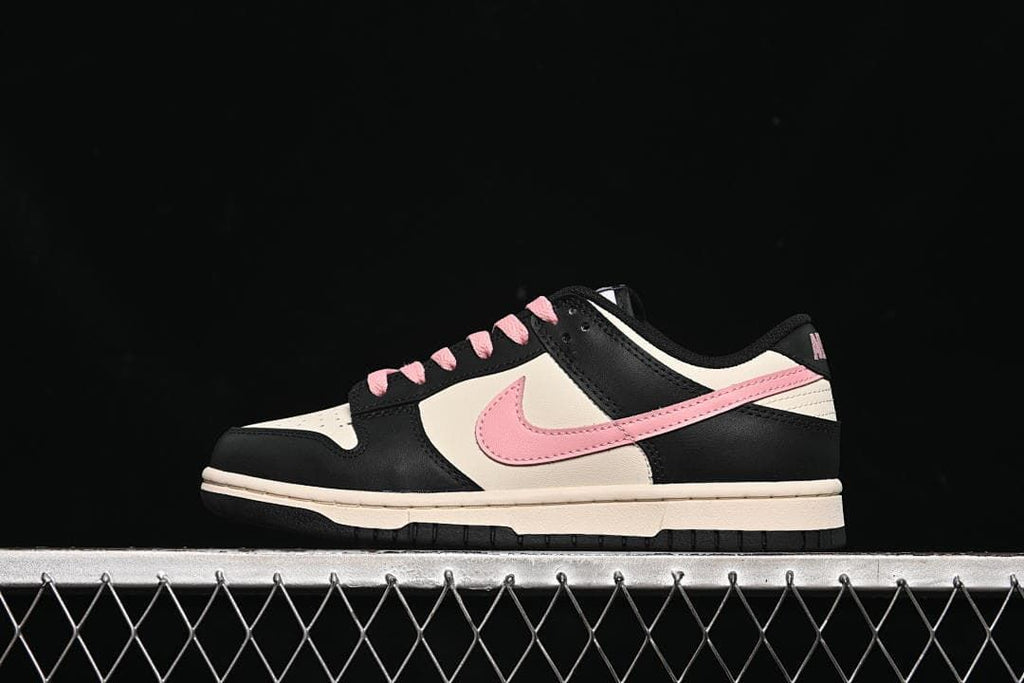 Side view of a black, off-white, and pink Nike Dunk Low sneaker