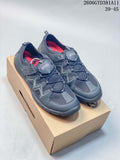 Pair of gray ECCO sneakers with elasticated laces and red interior accents, shown on a box.