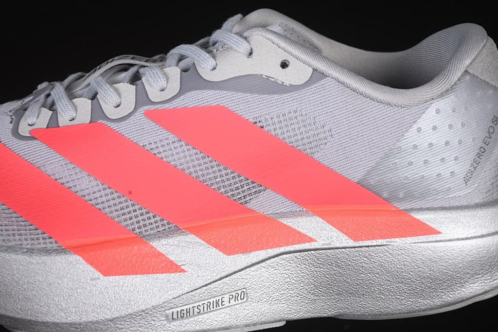 Close-up of the lateral side with coral stripes and Lightstrike Pro wording