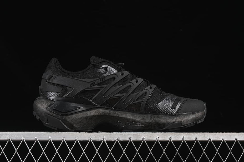 Side profile showing the layered panels and midsole