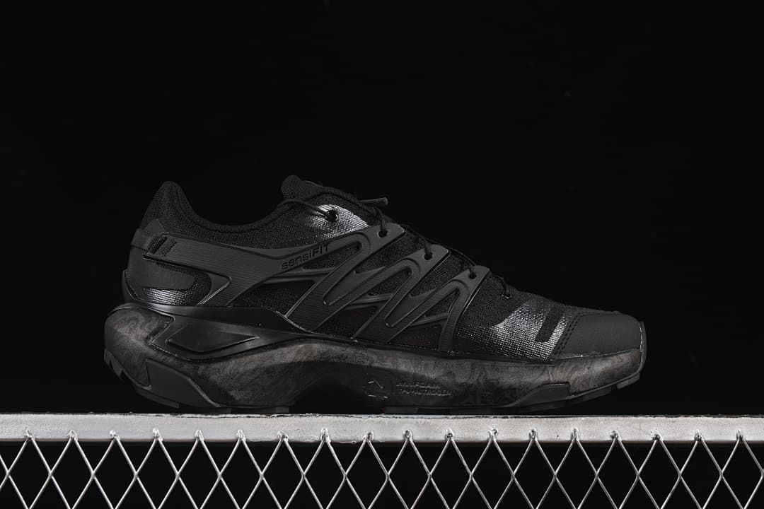 Side profile showing the layered panels and midsole
