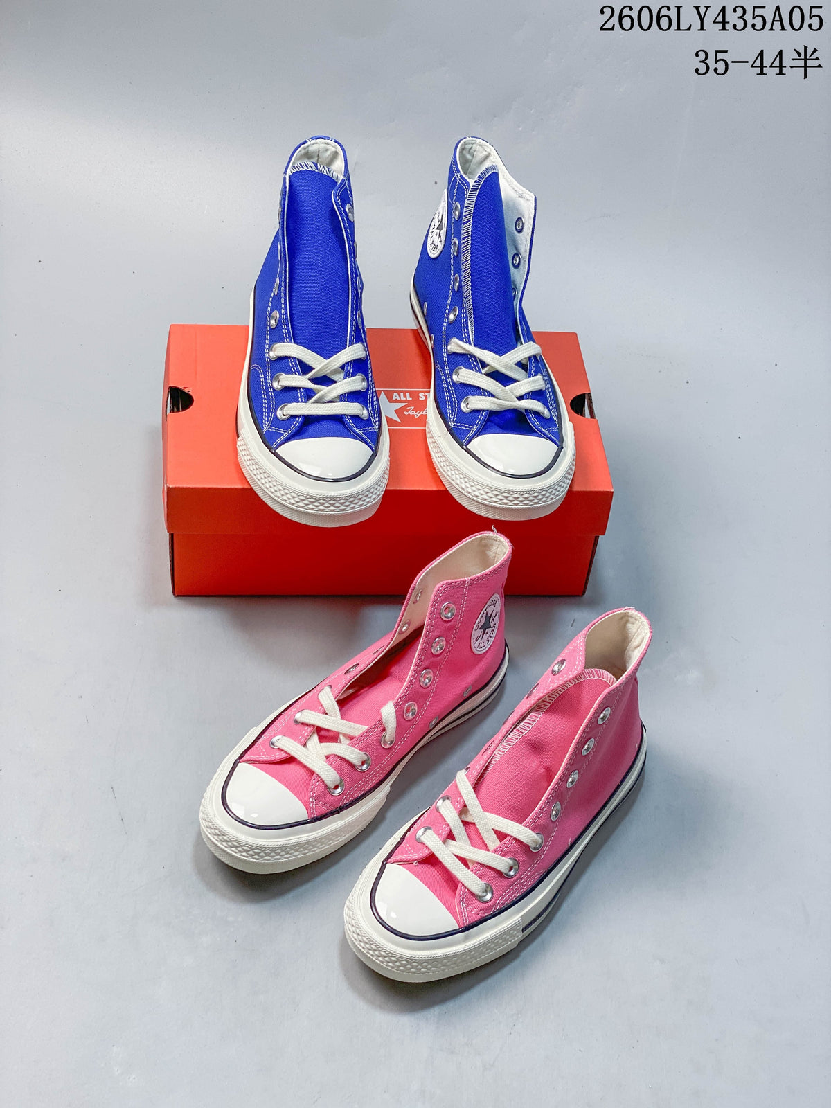 Blue and pink Converse Chuck Taylor 1970s-style high-top sneakers shown together