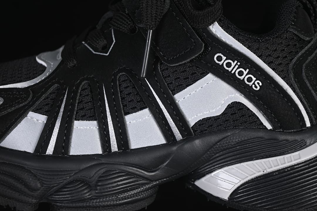 Close-up of the black and silver side panels and textured midsole