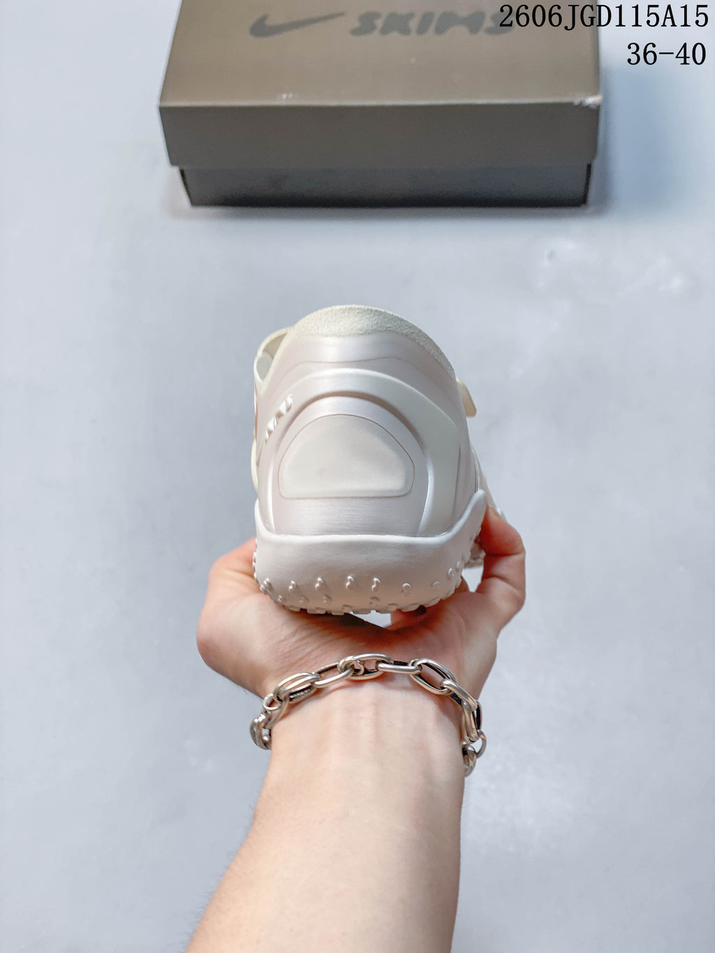 Rear view of a pale Nike Air Rift shoe