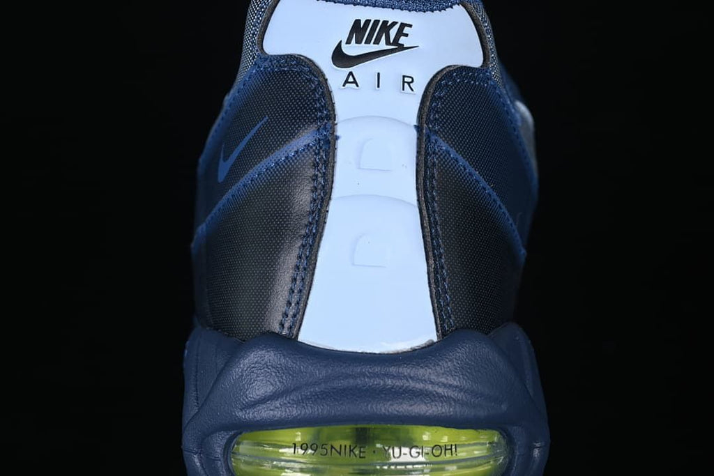 Rear view showing Nike Air branding and green-accented heel Air unit