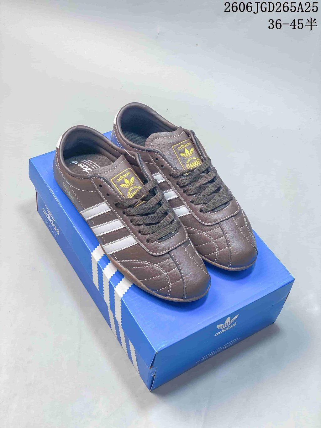 Brown adidas Originals Tokyo low-top sneakers with white side stripes and gum-colored soles