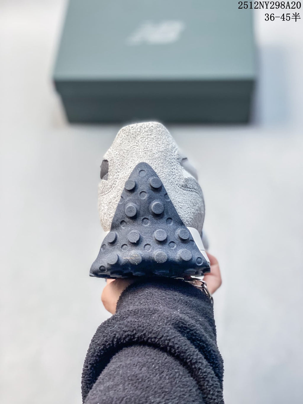 Rear view showing the raised outsole studs and heel of the sneaker