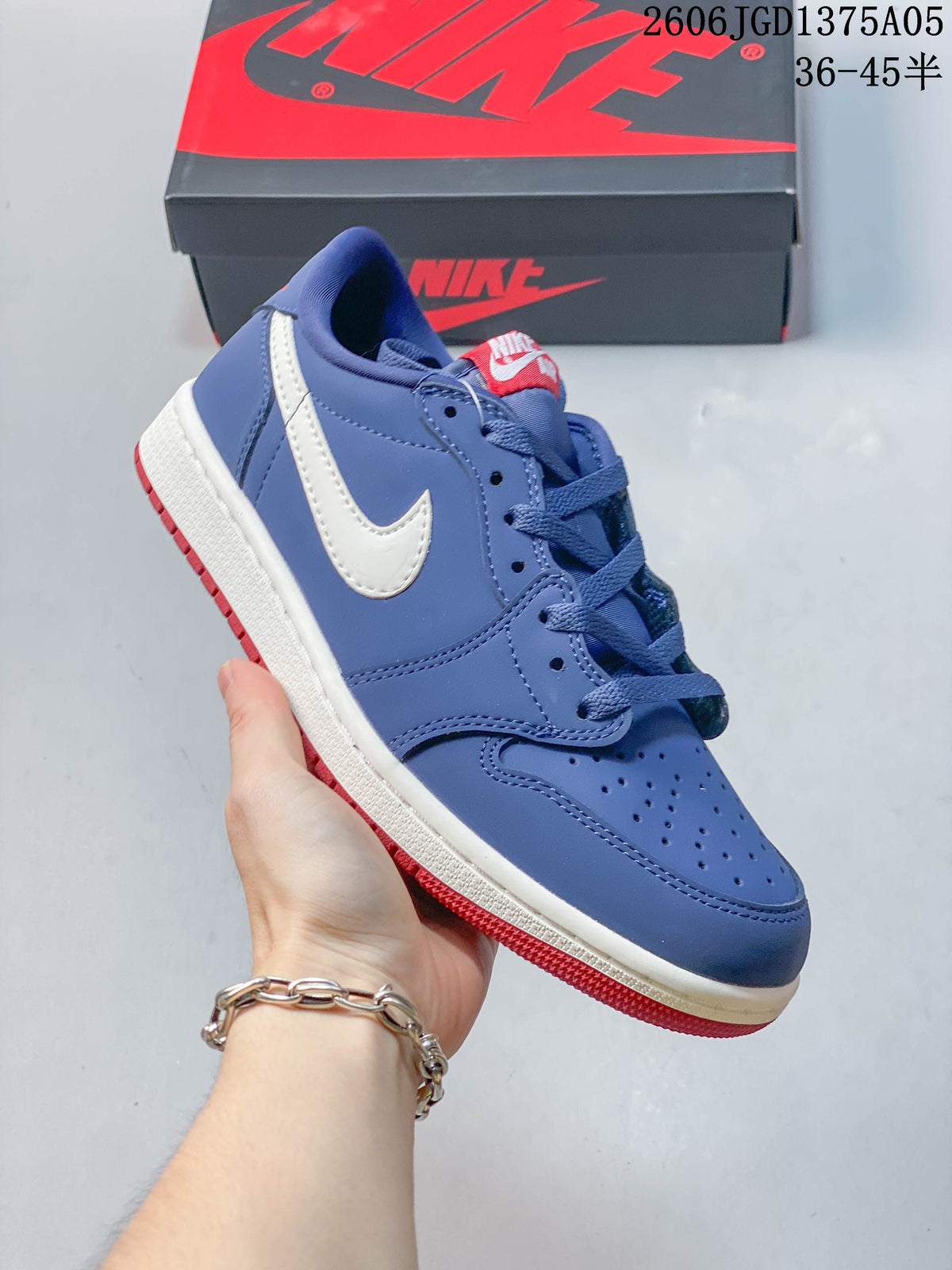 Close side view of the blue sneaker with white Swoosh and red outsole
