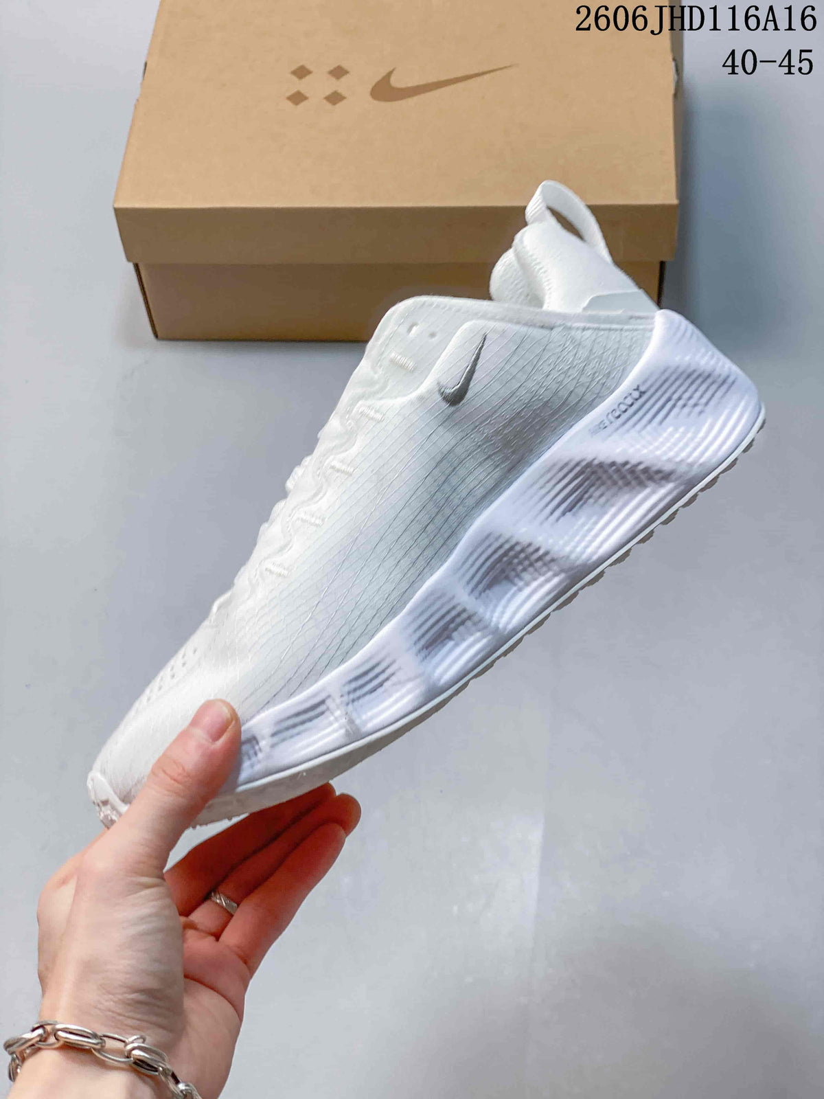 Side view of a white Nike Ava Rover shoe with a sculpted sole and dark Swoosh.