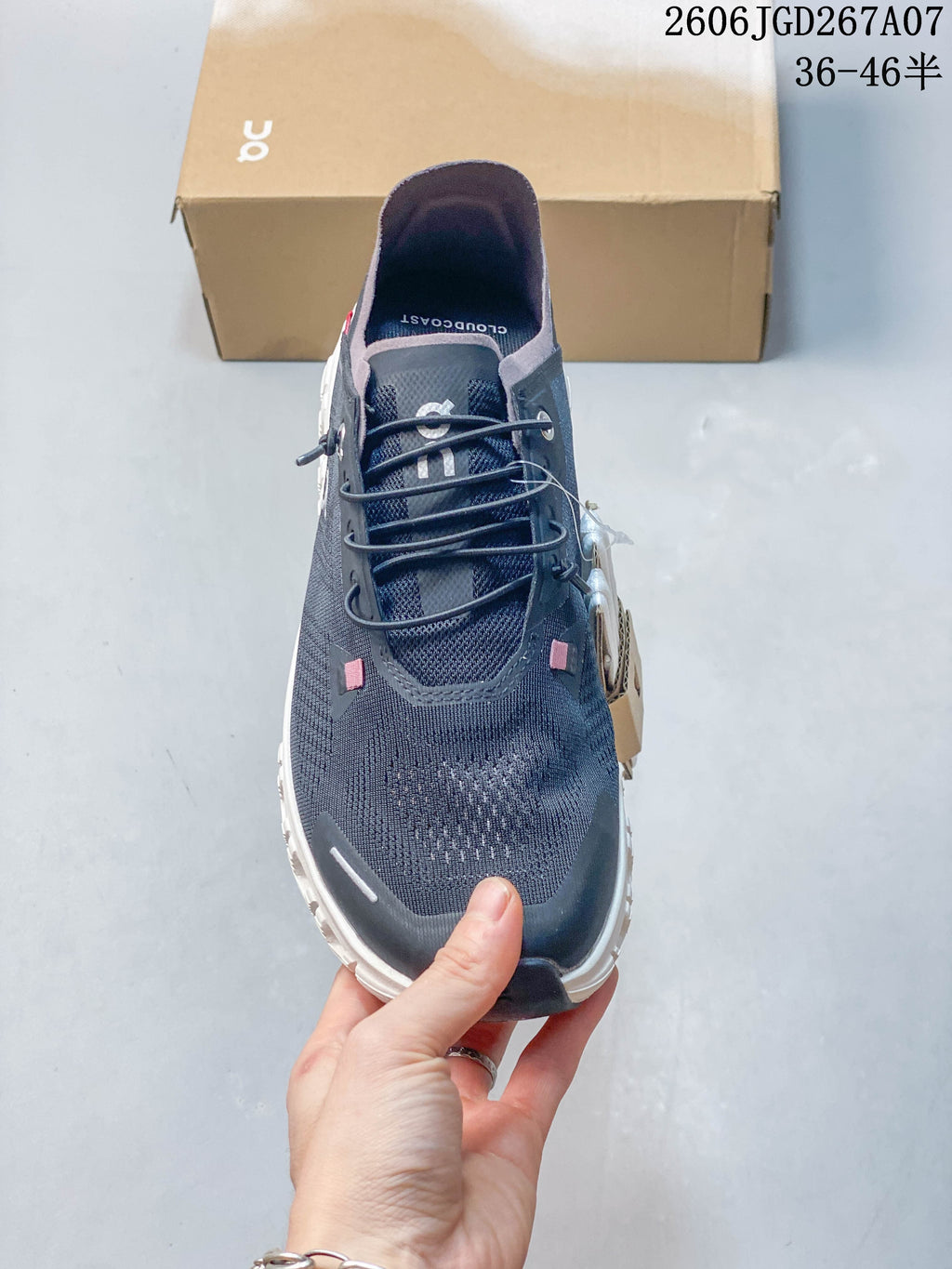 Top view showing the laces, knit-textured upper, and pink accents.