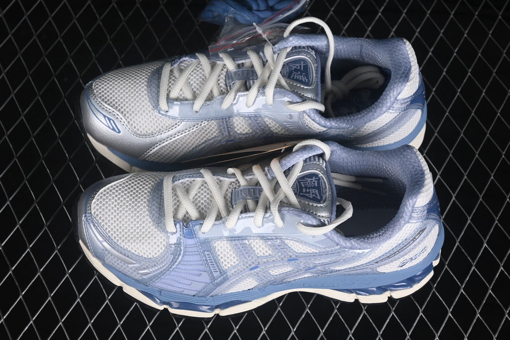 Top-down view of the pair showing the mesh uppers, white laces, padded collars, and blue detailing.