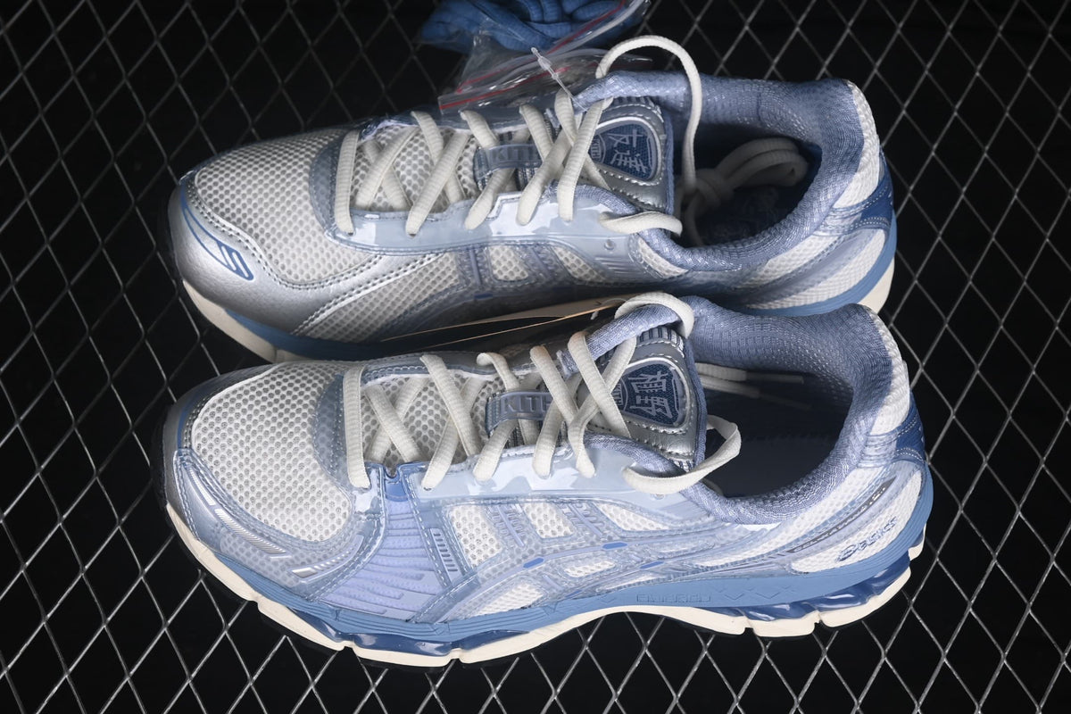 Top-down view of the pair showing the mesh uppers, white laces, padded collars, and blue detailing.