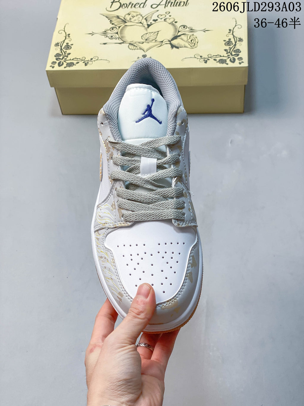Front view showing the perforated toe, gray laces, and Jordan tongue logo
