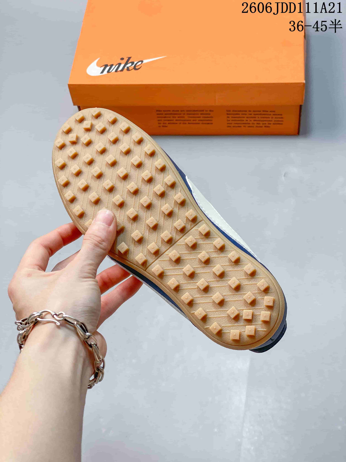 Underside of the sneaker showing a gum-colored outsole with raised tread blocks