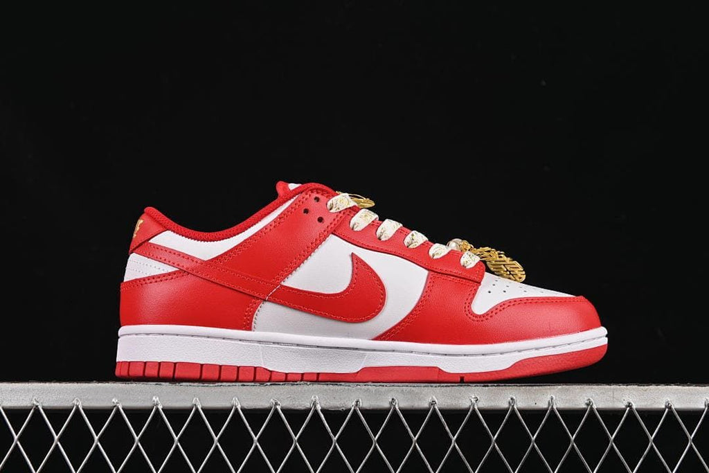 Side view of the red and white low-top sneaker