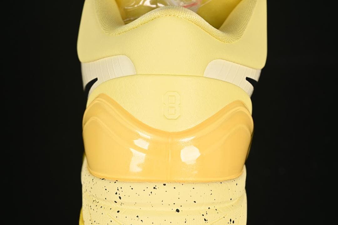 Rear view showing heel detail and speckled midsole