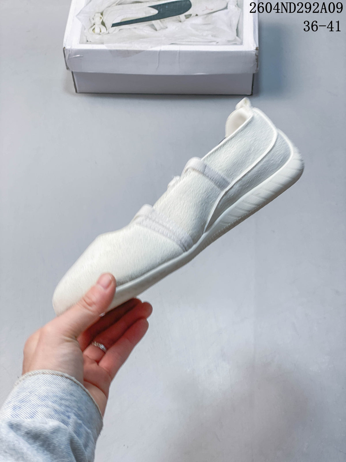 Side profile of the cream Puma ballet sneaker