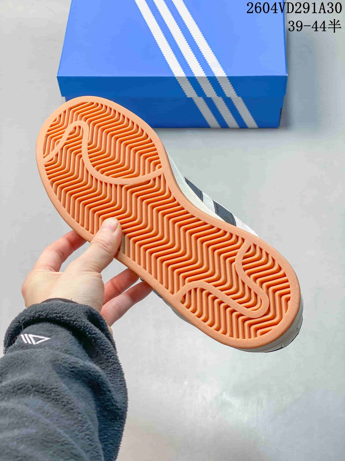 Close-up of the sneaker's gum-colored outsole with a patterned tread.