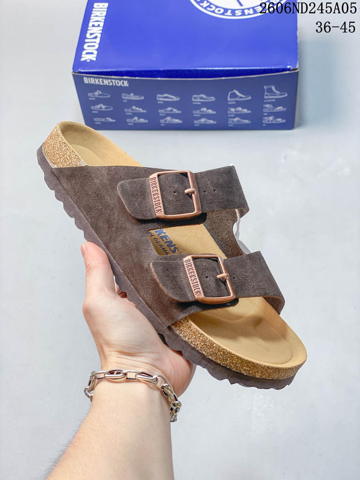 Dark brown two-strap sandal with adjustable buckles.