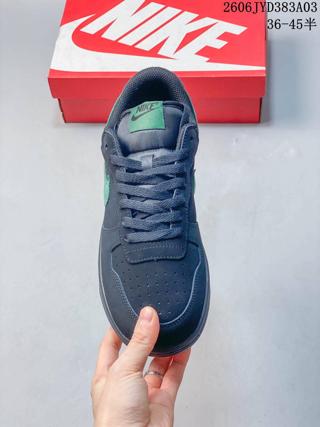 Front view of the sneaker showing its laces and perforated toe