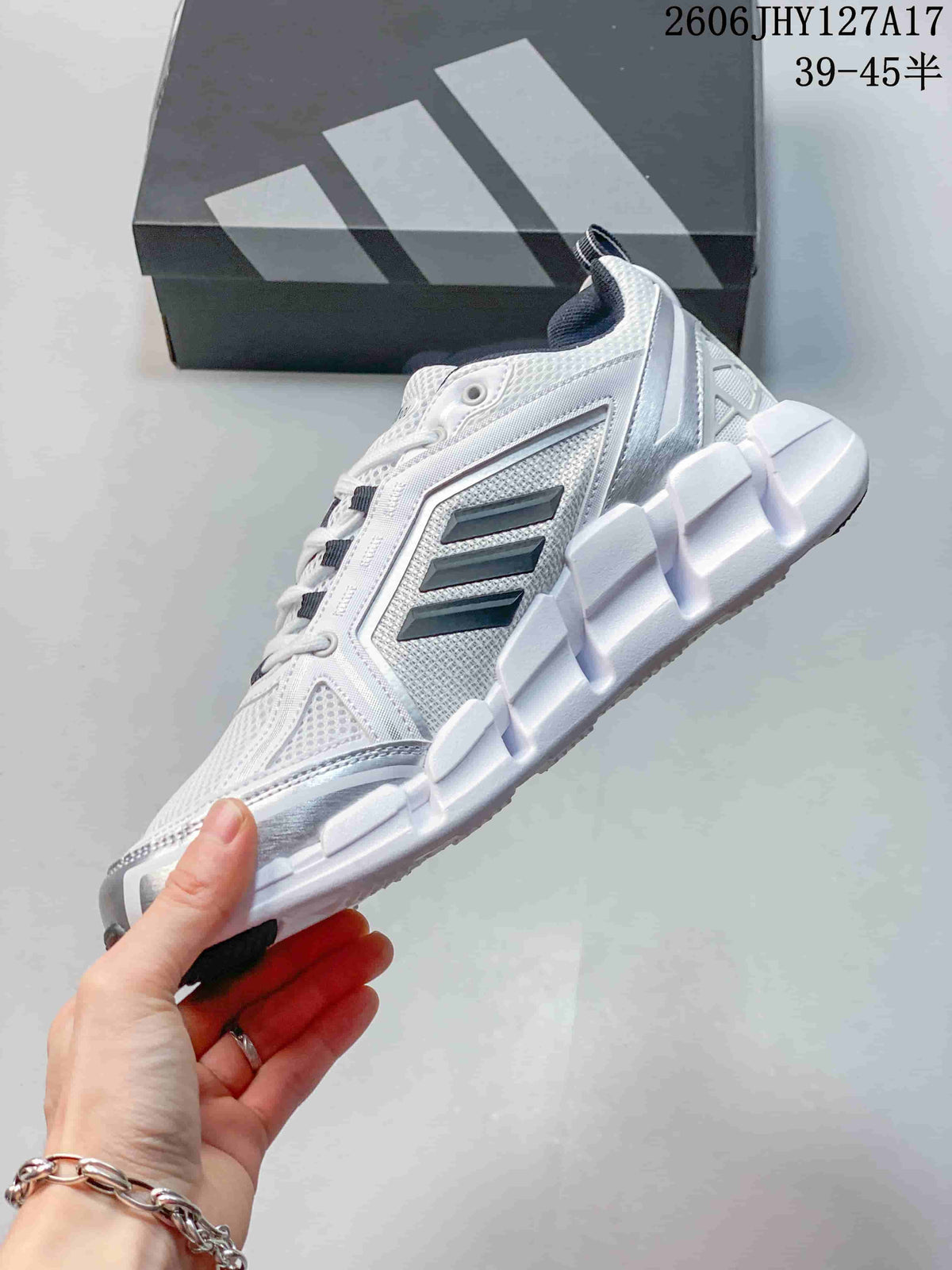 Side view showing mesh-look panels, dark stripes, and sculpted sole