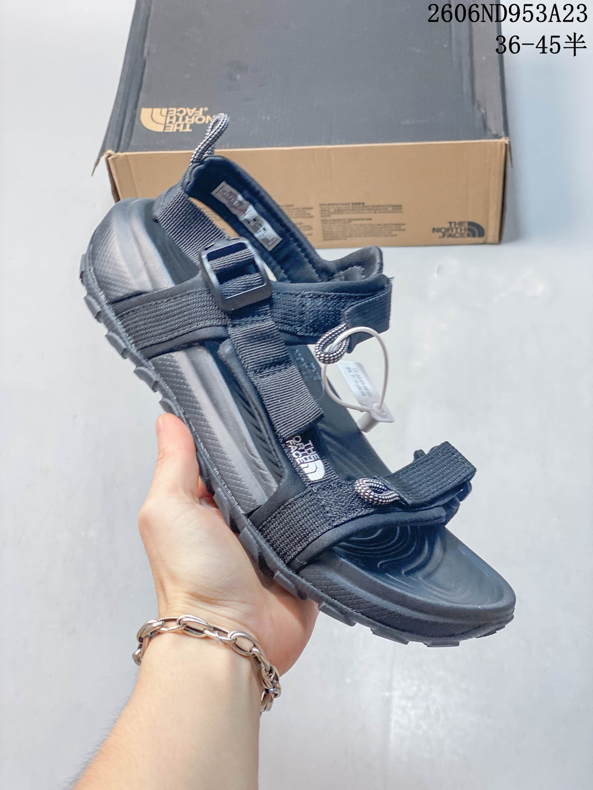 Angled view of the black Explore Camp sandal with adjustable straps