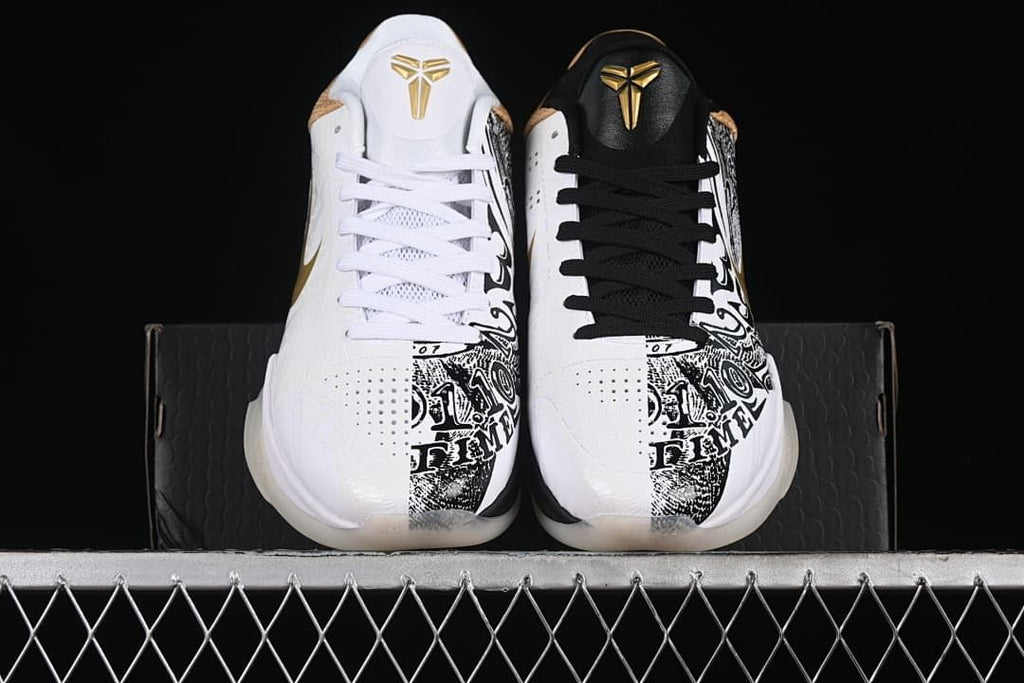 Front view of the pair showing contrasting black and white laces and graphic panels