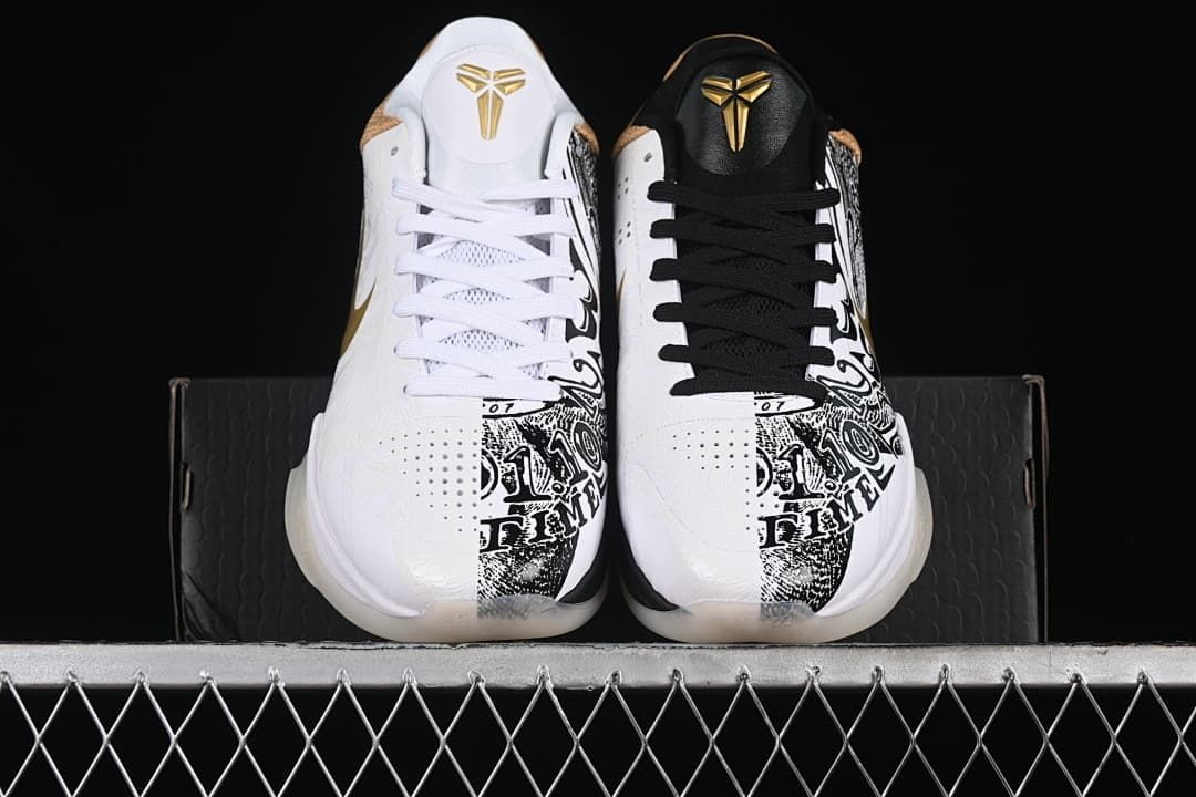 Front view of the pair showing contrasting black and white laces and graphic panels