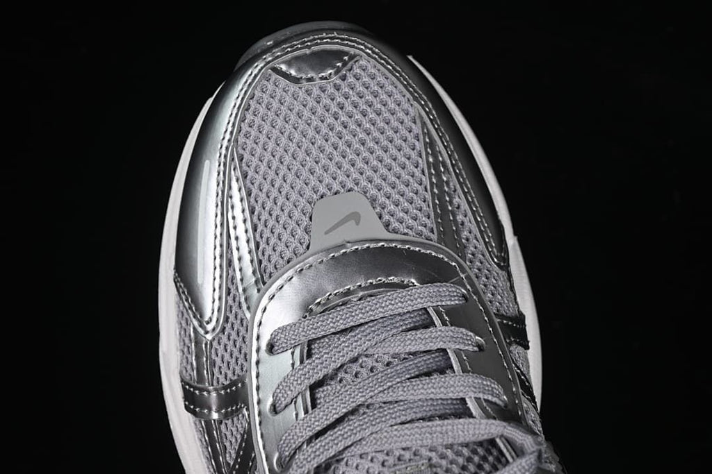 Top-down close-up of the mesh toe and lace area