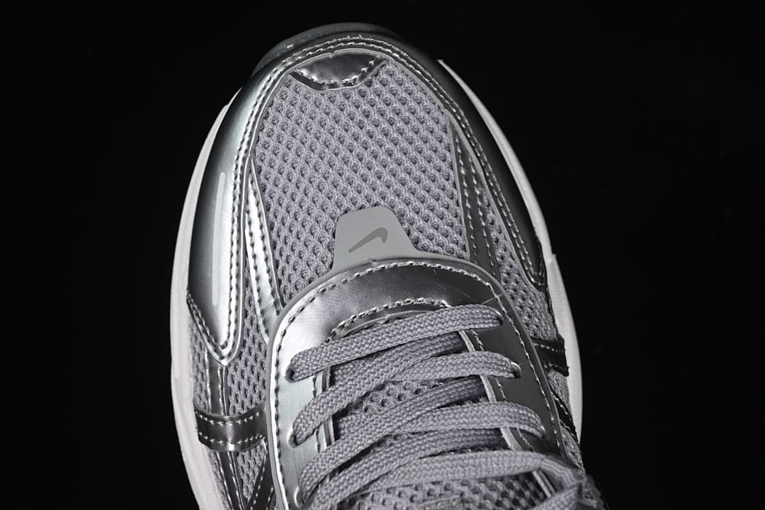 Top-down close-up of the mesh toe and lace area