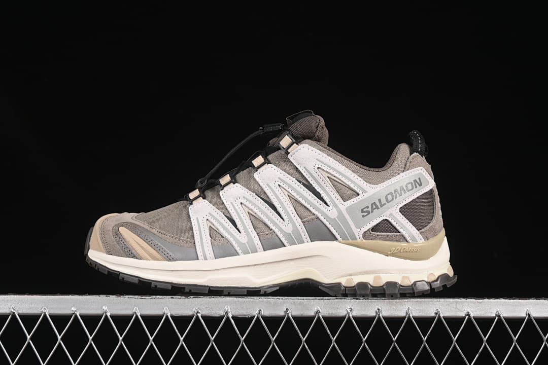 Side view of Salomon XA Pro 3D trail running shoe in gray-brown, off-white, and cream