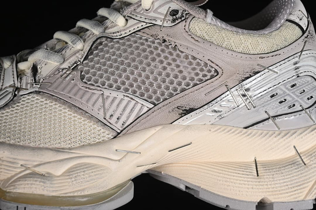 Close-up of mesh panels and layered sneaker construction
